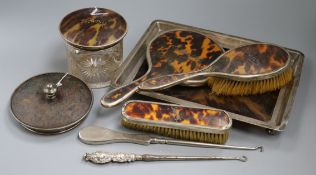 A matched silver-mounted tortoiseshell dressing table set, comprising a rectangular tray (a.f.),