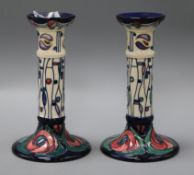 A pair of Moorcroft Mackintosh candlesticks H.21cm