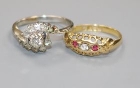 A white metal and diamond cluster ring and an early 20th century 18ct gold ring.