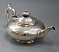 A Victorian silver teapot, of flattened circular form, London 1844, maker George Ivory, stamped '