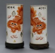 A pair of early 20th century Chinese 'lion-dog' porcelain hat stands total height including stands