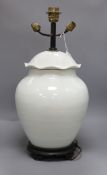 A Chinese white glazed porcelain jar and cover, late 19th/early 20th century, mounted as a lamp H.