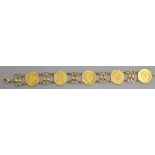 A 585 yellow metal bracelet set with five Austro Hungarian gold coins, 21.5cm.