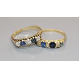 Two sapphire and diamond five stone rings, one stamped 18ct.