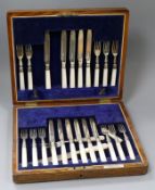 A cased set of twelve pairs of mother of pearl handled silver dessert eaters (one fork missing and