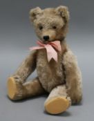 A 1950's Schuco 'Yes/No' teddy bear, Ria, with beige mohair, brown and black glass eyes,