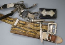 An early 20th century chatelaine including a silver whistle and paper knife and a silver mounted