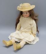 An early 20th century Armand Marseille German bisque headed doll, with open mouth sleeping eyes