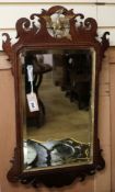 A George III fret cut wall mirror W.44cm