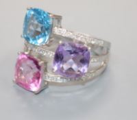 A modern 18ct white gold, diamond and gem set dress ring, set with topaz and amethyst, size R/S.