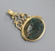 A Victorian yellow metal overlaid and bloodstone set spinning fob seal, with crested matrix, 50mm.