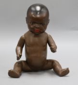 A Heubach-Koppelsdorf black closed mouth baby doll, 13in.