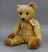 A 1930's Merrythought teddy bear, Chester, with golden mohair, large deep amber and black glass