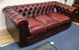 A leather button-back Chesterfield settee W.183cm