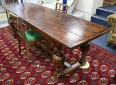 A 17th century style oak refectory table, with planked top and turned baluster legs fitted H