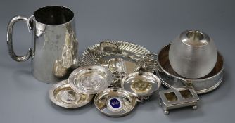An Edwardian silver mug, match tidy, silver stamp box, silver coaster, silver stand and other plated