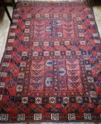 A Turkoman red 'twin field' rug 185 x 142cm