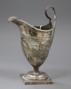 A George III silver helmet cream jug, London, 1794 (a.f.), 14cm.