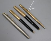 A 9ct gold pen and three other pens
