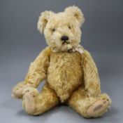 A 1930's Farnell teddy bear, Arthur, with golden curly mohair, clear and black glass eyes,