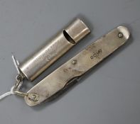 An Edwardian silver whistle by Saunders & Shepherd and a silver mounted pen knife.