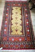 A Persian yellow field rug 170 x 90cm