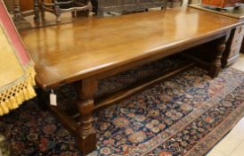 A 17th century style oak refectory table W.285cm