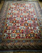 A Caucasian bright geometric coloured carpet 340 x 266cm
