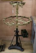 A Victorian brass and wrought iron votive stand W.70cm