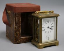 An early 20th century cased brass carriage timepiece with alarm