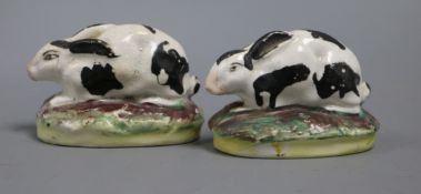 A pair of Staffordshire pottery miniature rabbits height 5cm