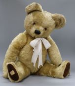 A 1950's Chad Valley teddy bear, Nicky, with golden mohair, deep amber and black glass eyes, black