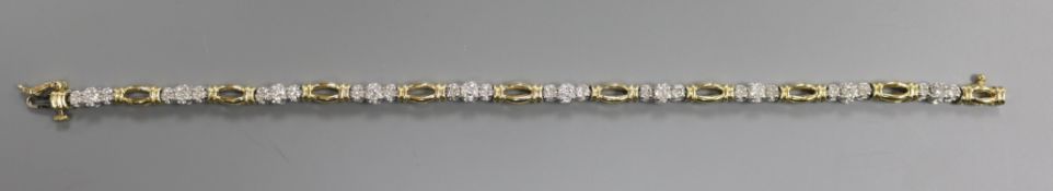 A two-colour gold bracelet, marked 10K and 2ct (diamond weight) to clasp, in Helzberg Diamonds case