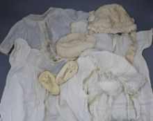 A collection of silk and other white worked baby clothes, bonnets etc