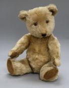 A 1950's Chiltern musical teddy bear, Lewis, with pale golden mohair, deep amber and black glass