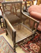 A 1920's caned oak bergere chair