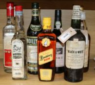 Eleven bottles of spirits and port, including Dewar's White Label and Buchanan's Black & White, both
