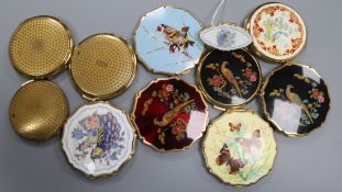 A collection of vintage powder compacts by Stratton, three decorated with pheasants, two with