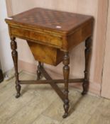 A Victorian walnut games/work table W.59cm