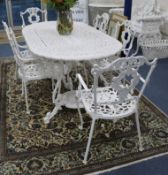 A white painted cast aluminium garden table and six chairs W.170cm