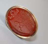 A 19th century yellow metal overlaid and carnelian fob seal, with crested matrix (af), 40mm.