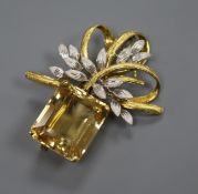 A 14k two colour gold and citrine scrolling brooch, 55mm.