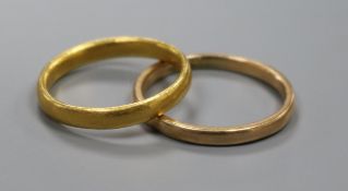 One 22ct gold band and one 9ct gold band.