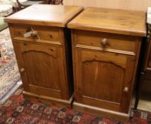 A pair of pine bedside cabinets W.53cm