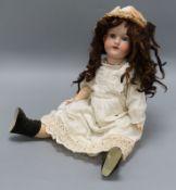 An Armand Marseille bisque headed doll, open mounted with sleeping eyes, jointed body, impressed