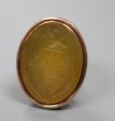 A 19th century yellow metal overlaid and carnelian set fob seal, with crested matrix and swan neck