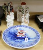 A quantity of Staffordshire figures and a Delft charger