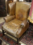 A leather wing armchair