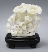 A Chinese jade carving on ebonised stand overall height 20cm