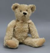 An American teddy bear, Jenny, c.1912, with pale blond mohair, black boot button eyes, black